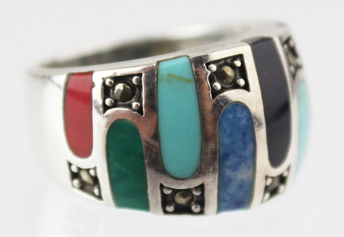 STERLING RING TURQUOISE ONYX LAPIS MALACHITE CORAL: STERLING RING TURQUOISE ONYX LAPIS MALACHITE CORAL Ladies sterling ring featuring inlaid onyx, lapis, malachite, and coral with marcasite accents. Marked 925. Weight: 8.8g Size: 8 Est. $20-40 Lot: 331