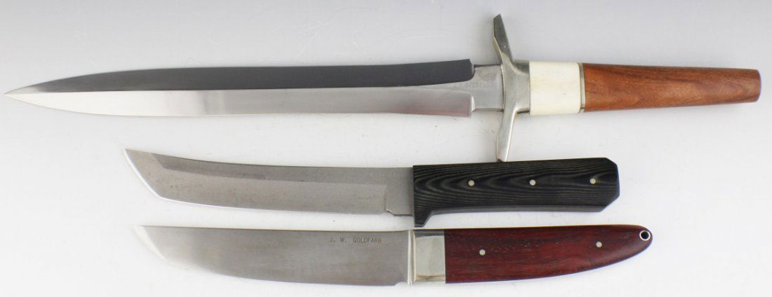 LOT OF 3 J.W. GOLDFARB FIXED BLADE KNIVES: LOT OF 3 J.W. GOLDFARB FIXED BLADE KNIVES Lot of 3 J.W. Goldfarb Fixed Blade knives. Light Brown Bone over Wood Handled measures total 18.5" with 12.25 blade. possible repair mark on ricasso. Dark Bro