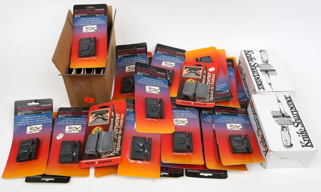 LOT OF KNIFE SHARPENERS: LOT OF KNIFE SHARPENERS A dealers lot of mostly pocket knife sharpeners. New in packets. 50 in total. Est. $50-100 Lot: 33282