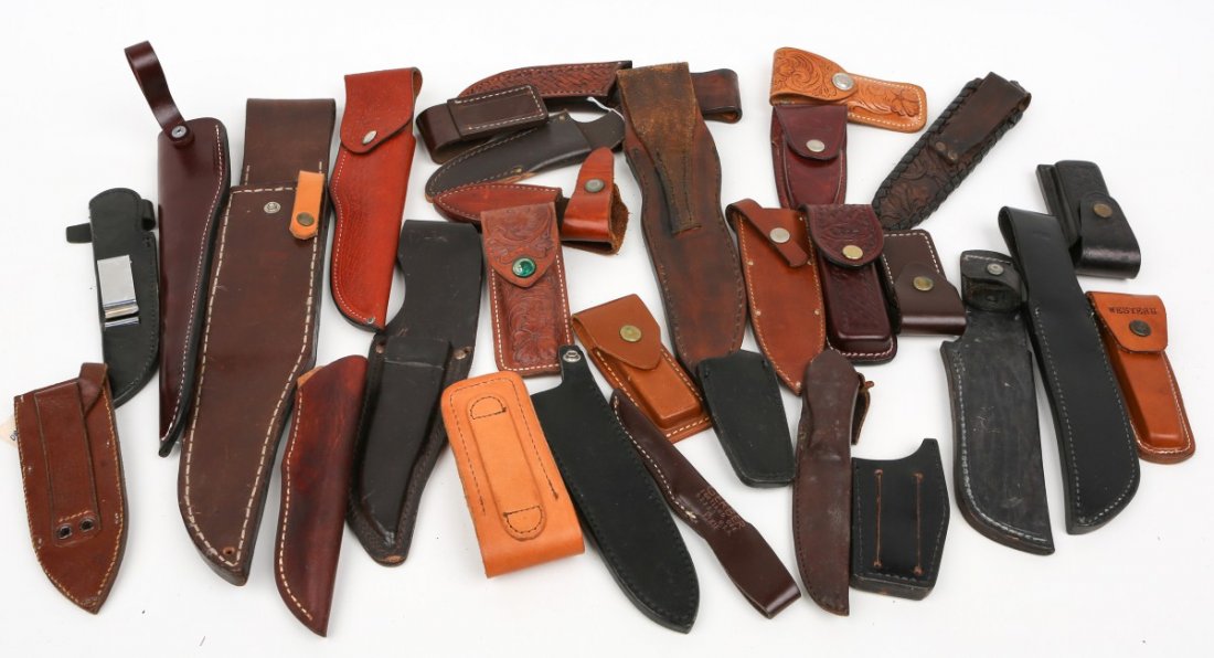 MIXED LOT OF 30 KNIFE SHEATHS ALL LEATHER: MIXED LOT OF 30 KNIFE SHEATHS ALL LEATHER A dealers lot of 30 leather sheaths of different shapes and sizes. Includes folding knives. Some may be named. Please see pictures before bidding. Size: vario