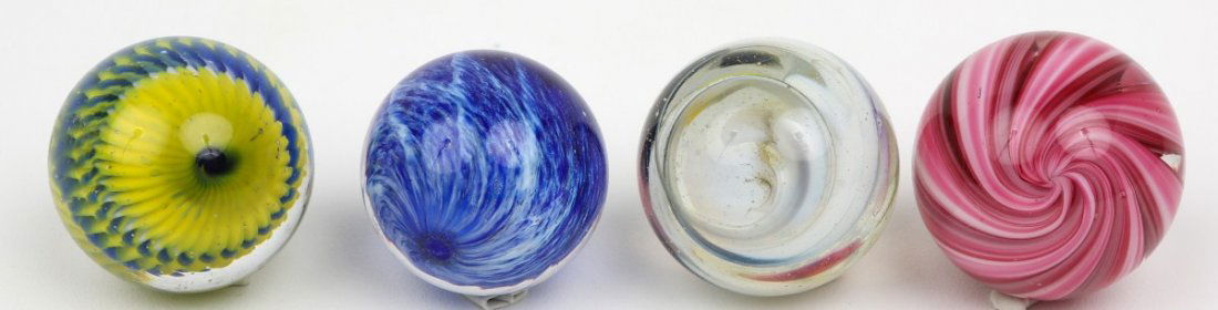 LOT OF FOUR CORKSCREW SWIRL SNAKESKIN MARBLES: LOT OF FOUR CORKSCREW SWIRL SNAKESKIN MARBLES Grouping of 4 handmade glass marbles sizes ranging from 38mm to 41mm. The blue marble is a Jim Davis and is 38mm. Est. $30-50 Lot: 33304