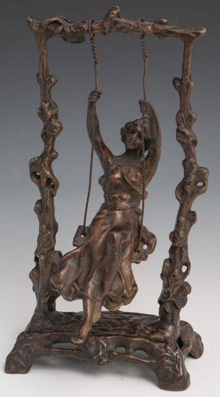 AFTER AUGUSTE MOREAU - SWING GIRL IN BRONZE: AFTER AUGUSTE MOREAU - SWING GIRL IN BRONZE A bronze sculpture after the original French "Swing Girl" by Auguste Moreau. Monochromatic bronze girl seated on a swing suspended by a bronze arbor. Size: