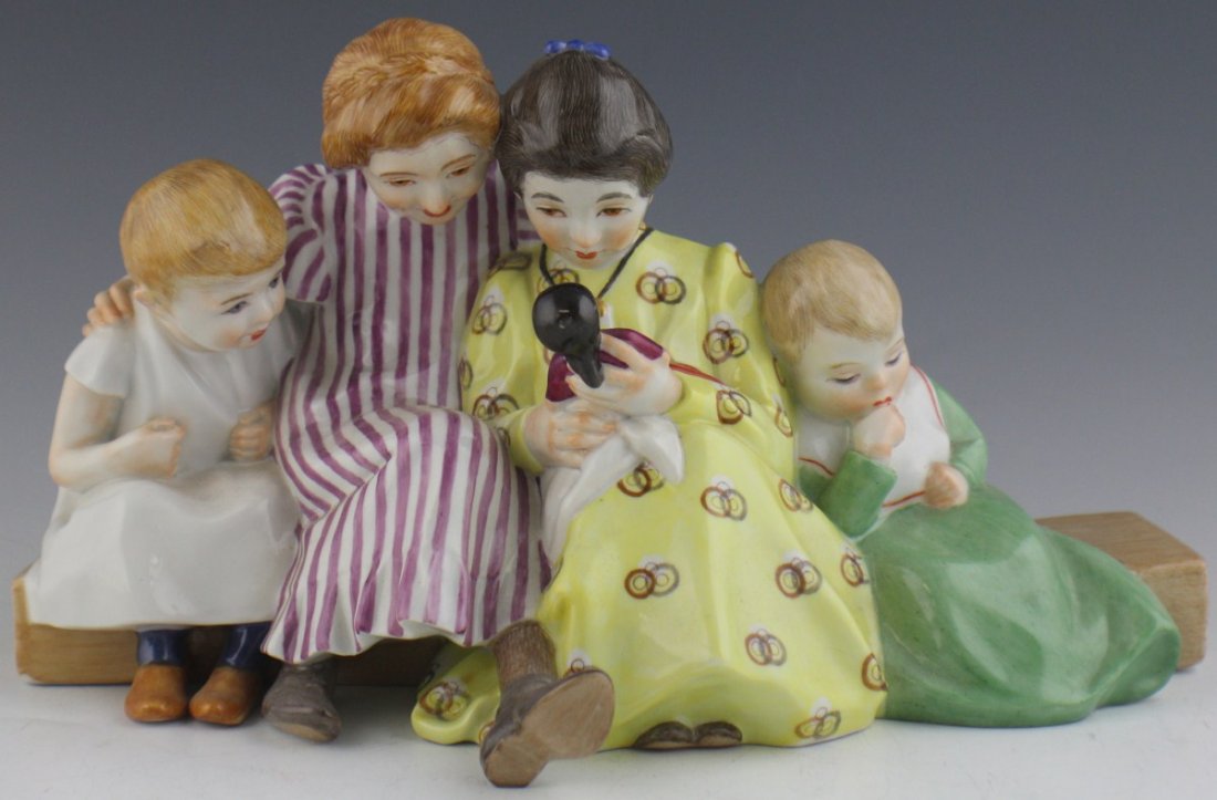 MEISSEN PORCELAIN 1905 FIGURAL GROUP OF CHILDREN: MEISSEN PORCELAIN 1905 FIGURAL GROUP OF CHILDREN Meissen porcelain representation of four children sitting on a bench playing with a doll. Model No. 73373 painters number 178. Modeled by Konrad Hentsc