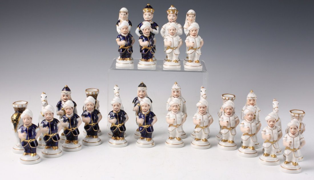 ROYAL DUX CZECH CHESS SET: ROYAL DUX CZECH CHESS SET 32 piece full porcelain hand painted Czechoslovakian chess set in Tartar attire. Each side is differentiated by white and blue themed clothing, while both have gilded trim. P