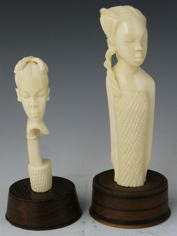 TWO CARVED AFRICAN IVORY BUSTS 20TH CENTURY: TWO CARVED AFRICAN IVORY BUSTS 20TH CENTURY Lot of two carved African ivory busts. Both female figures in 20th century dress. Size: 6 - 8" (with stand)