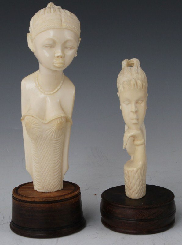 TWO CARVED AFRICAN IVORY BUSTS 20TH CENTURY: TWO CARVED AFRICAN IVORY BUSTS 20TH CENTURY Lot of two carved African ivory busts. Both female figures in 20th century dress. Size: 6 - 8" (with stand)
