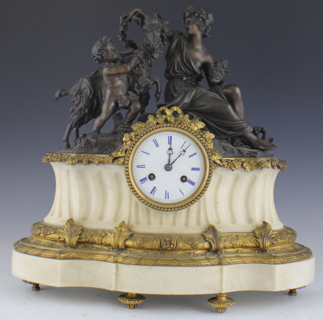 ALABASTER AND BRONZE MANTLE CLOCK: ALABASTER AND BRONZE MANTLE CLOCK White alabaster with bronze top featuring Dionysian scene. Size: 17 x 17 x 6"