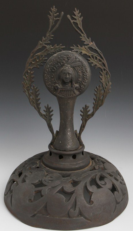CAST IRON ROUND OAK STOVE TOP: CAST IRON ROUND OAK STOVE TOP Top to Round Oak wooden stove, features fictional Indian Chief character Doe-Wah-Jack. Size: 15"