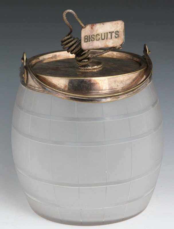 EDWARDIAN GLASS AND SILVER PLATE BISCUIT JAR: EDWARDIAN GLASS AND SILVER PLATE BISCUIT JAR Early 20th century etched glass biscuit jar in the form of a barrel with silver plated cover inscribed "biscuits." Size: 7"