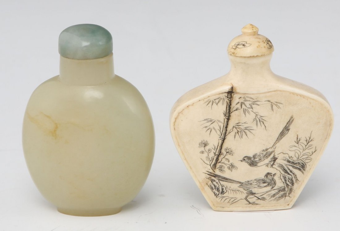 ONE IVORY & ONE CELADON JADE CHINESE SNUFF BOTTLE: ONE IVORY & ONE CELADON JADE CHINESE SNUFF BOTTLE Smooth carved jade bottle, signed to the base and a carved ivory example with picture and script. Spoons included. Size: 2.5"