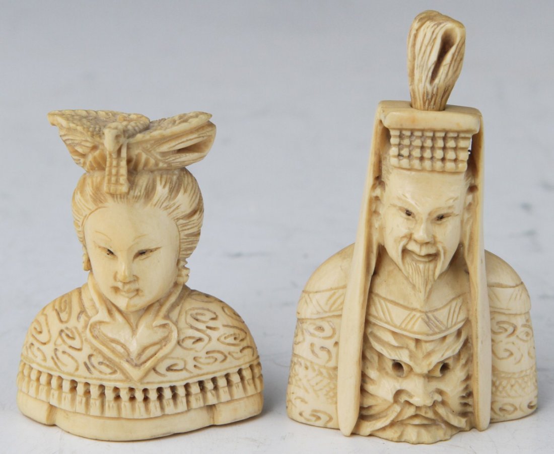 PAIR OF CHINESE IMPERIAL IVORY SNUFF BOTTLES: PAIR OF CHINESE IMPERIAL IVORY SNUFF BOTTLES A Chinese pair of carved ivory snuff bottles, emperor and empress busts. The emperor has dragon decor on his chest, empress features a phoenix head piece.