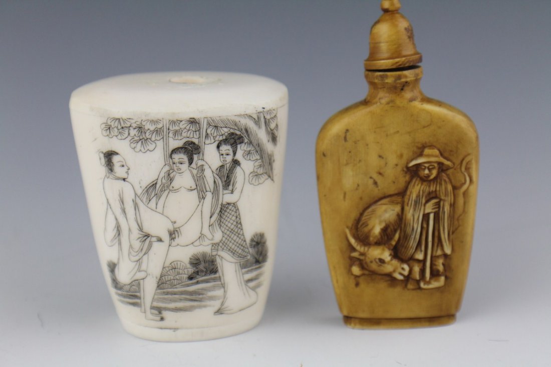 TWO CARVED IVORY SNUFF BOTTLES EROTIC SIGNED: TWO CARVED IVORY SNUFF BOTTLES EROTIC SIGNED Two carved ivory snuff bottles. The first is a stained carving, the front of which is etched with a farmer and his ox, the reverse bears a corn stalk and a