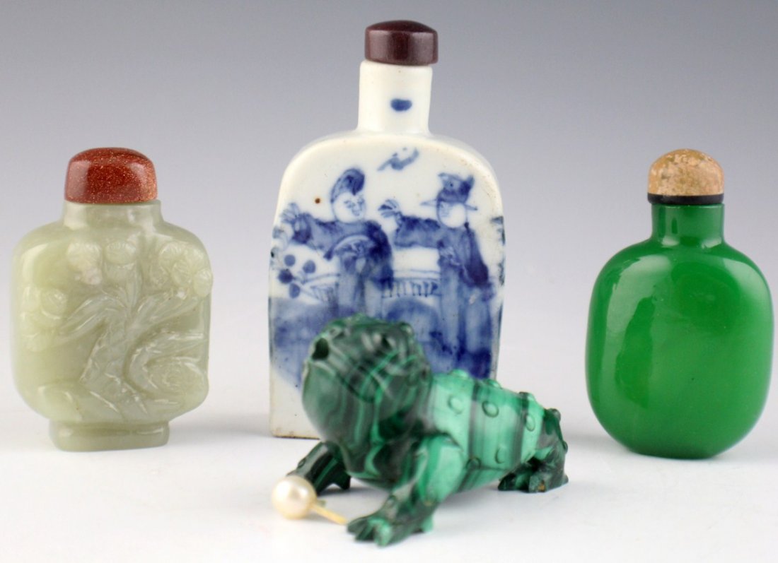 FOUR CHINESE SNUFF BOTTLES - PORCELAIN STONE GLASS: FOUR CHINESE SNUFF BOTTLES - PORCELAIN STONE GLASS Four Chinese snuff bottles ranging from 2.5 - 3.75". Blue painted porcelain, glass, jade, and a malachite snuff bottle in the shape of a gecko (spoon