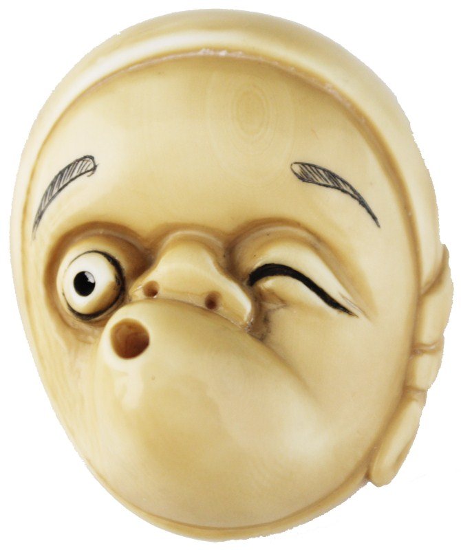 JAPANESE CARVED IVORY NETSUKE NOH MASK SIGNED: JAPANESE CARVED IVORY NETSUKE NOH MASK SIGNED A very well executed figural netsuke showing a whistling, winking face of a child. Enhanced with black pigment and signed by the artist. Size: Approx 2" *