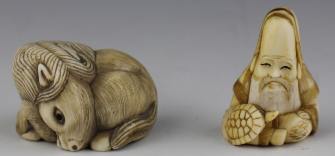 TWO CARVED IVORY FIGURAL NETSUKE SIGNED: TWO CARVED IVORY FIGURAL NETSUKE SIGNED Two carved ivory netsuke. The first is a seated Fukurokujo figure, the god of longevity, wisdom and fortune. On his lap is a turtle, his elongated head is cover