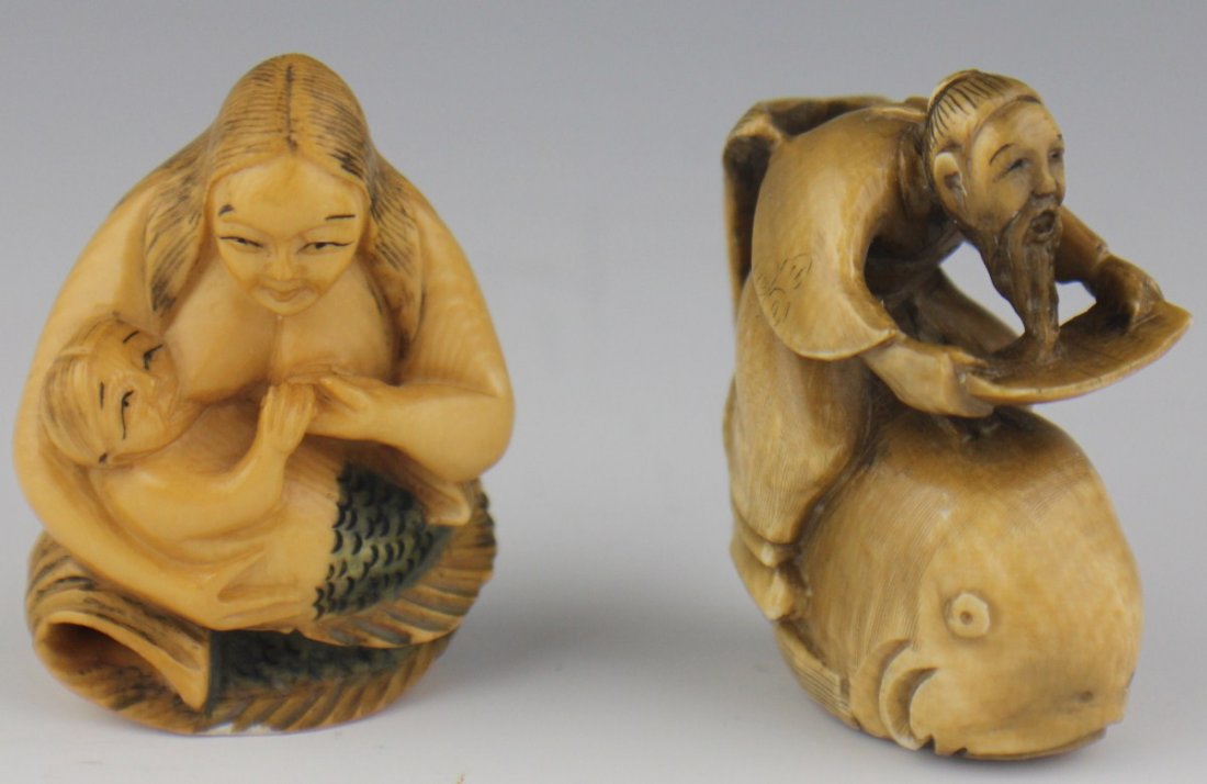 TWO CARVED IVORY OCEAN THEME NETSUKE: TWO CARVED IVORY OCEAN THEME NETSUKE Two carved ivory netsuke of ocean theme. The first is a seated mermaid mother suckling her young. Polychrome stain. Signed to base. The second is a depiction of an