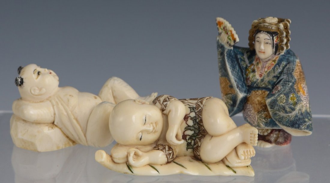 THREE CARVED IVORY NETSUKE - BABIES & A LADY: THREE CARVED IVORY NETSUKE - BABIES & A LADY Three ivory netsukes, two carved in the form of babies. Size: 1.5" or so. **Please be advised: International shipping it NOT permitted on items containing 