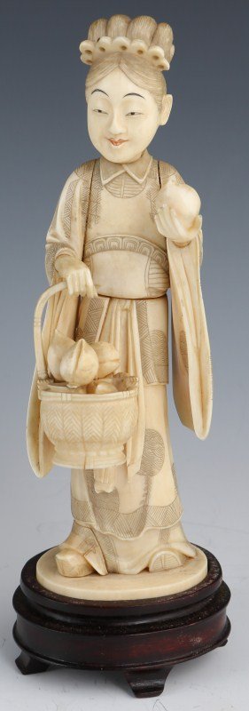 CHINESE SECTIONALIZED IVORY FIGURE OF A LADY: CHINESE SECTIONALIZED IVORY FIGURE OF A LADY Sectionalized carved elephant ivory figure of a lady fruit seller. Arms, head, hands, basket, fruit are pegged (and some are glued). Signed base. Size: 8.5