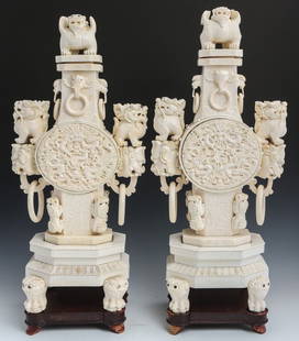 PAIR OF ANTIQUE ORNATE CHINESE CARVED IVORY URNS: PAIR OF ANTIQUE ORNATE CHINESE CARVED IVORY URNS Pair of antique ivory and ivory clad urns. Intricately carved with dragons and other mythical creatures. The urns are in classical form and come presen