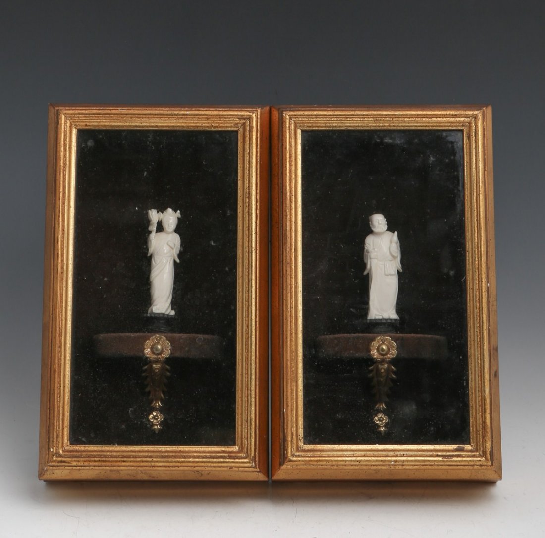 PAIR OF IVORY FIGURES IN SHADOW BOXES: PAIR OF IVORY FIGURES IN SHADOW BOXES Pair of ivory figures standing about 3" on a stand in gold framed shadow boxes. Size: 10 x 6" **Please be advised: International shipping it NOT permitted on item