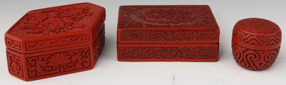 LOT OF 3 CHINESE CINNABAR LACQUERED BOXES: LOT OF 3 CHINESE CINNABAR LACQUERED BOXES A lot of three Chinese cinnabar lacquered boxes, a rectangular, egg and irregular hexagonal shaped box. The rectangular and hexagonal boxes both have cubic sp