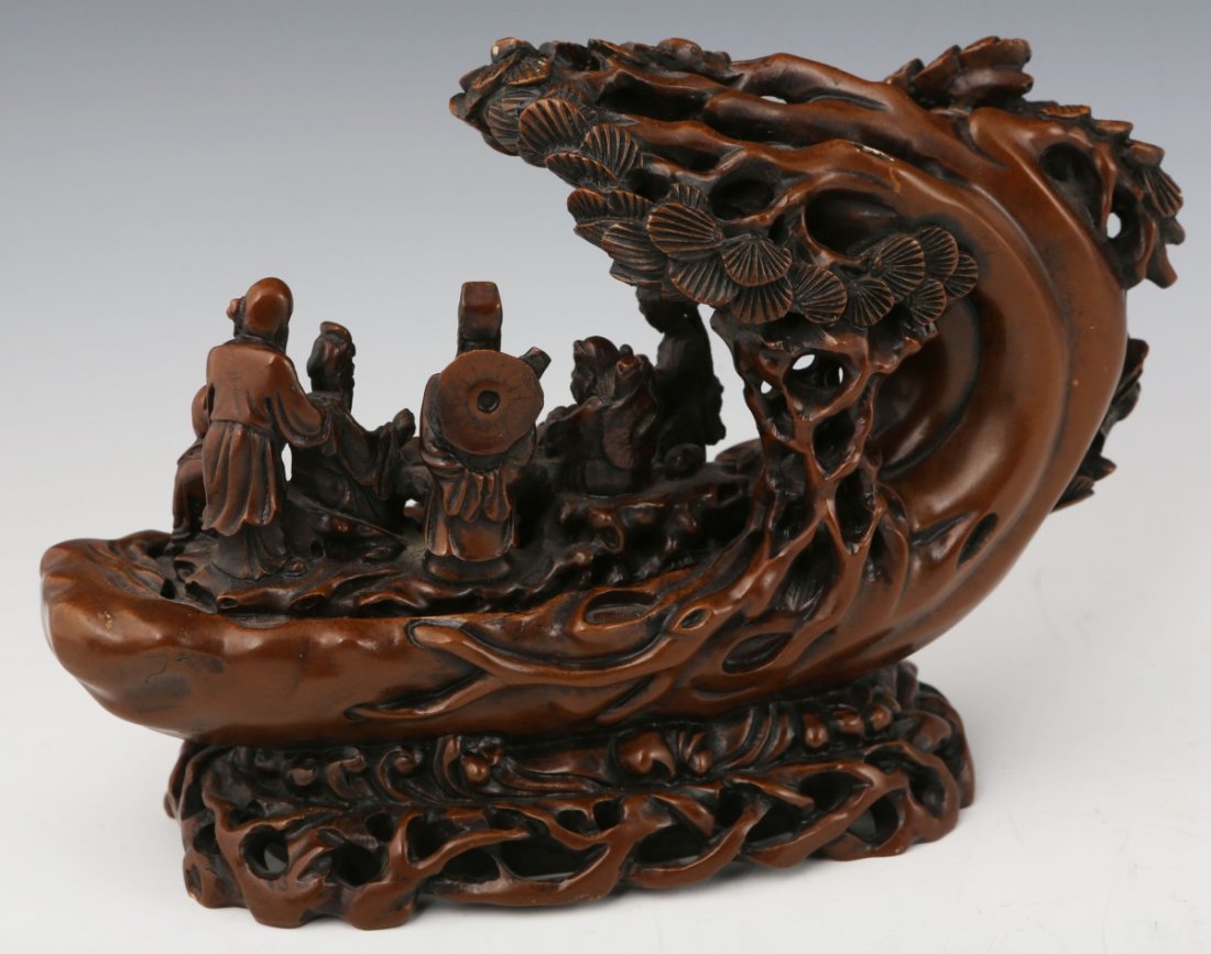 CARVED SOAPSTONE EIGHT IMMORTALS FIGURAL GROUPING: CARVED SOAPSTONE EIGHT IMMORTALS FIGURAL GROUPING A Chinese carving of the eight immortals gathered around a table that is an extension of the tree they are all situated in. The soapstone is of a brow