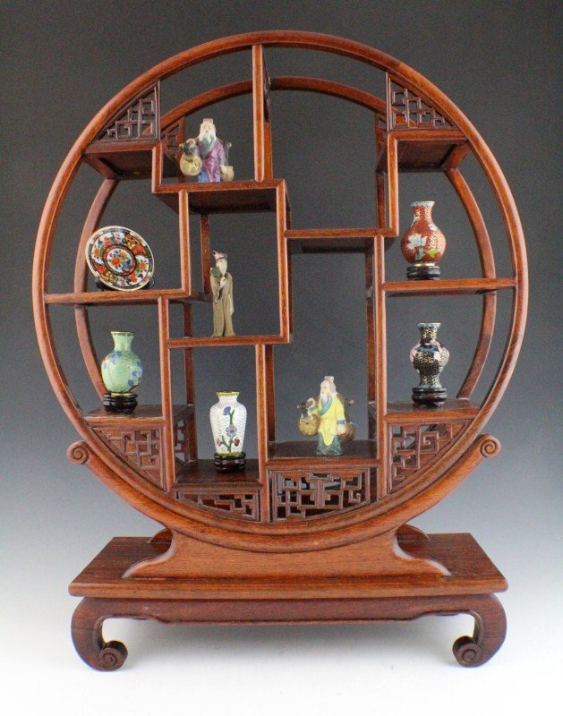 MINIATURE CLOISONNE ITEMS WITH DISPLAY SHELF: MINIATURE CLOISONNE ITEMS WITH DISPLAY SHELF Four miniature cloisonne items with stands. Also included is round wooden display shelf, and three ceramic figures. Size: 19 x 14"