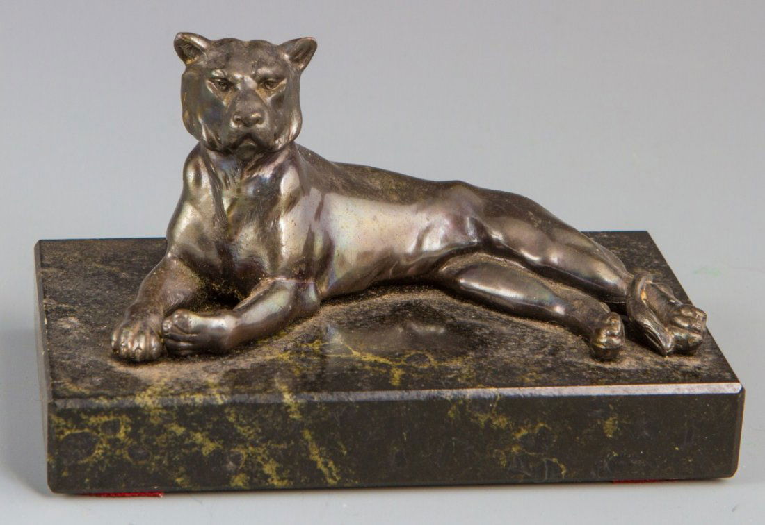 SMALL CAST BRONZE LIONESS FIGURE ON MARBLE BASE: SMALL CAST BRONZE LIONESS FIGURE ON MARBLE BASE A cast bronze figure of a reclining lioness. Mounted to a 5 x 3 x 3/4" marble base. No signature. From the estate of Francois Bucher. Size: 5 x 3 x 3" w