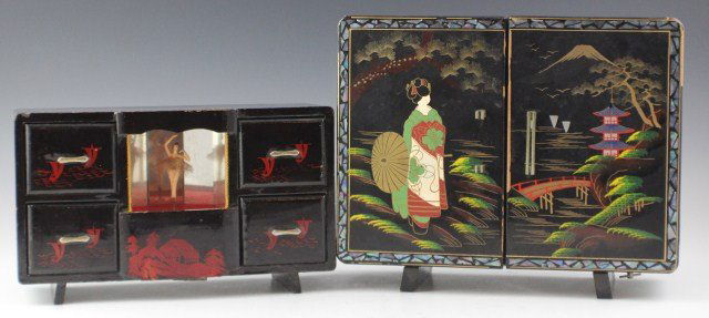 TWO JAPANESE BLACK LACQUER MUSICAL JEWELRY BOXES: TWO JAPANESE BLACK LACQUER MUSICAL JEWELRY BOXES Two black lacquered musical jewelry boxes with moving parts. Larger box has some losses to lacquer and a broken handle. Smaller box has some loss to la