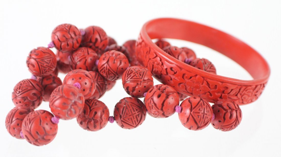 LADIES CINNABAR JEWELRY - BRACELET & NECKLACE: LADIES CINNABAR JEWELRY - BRACELET & NECKLACE Ladies 24" strand of 15mm cinnabar beads and cinnabar bangle with 2.75" diameter. Weight: 86.9