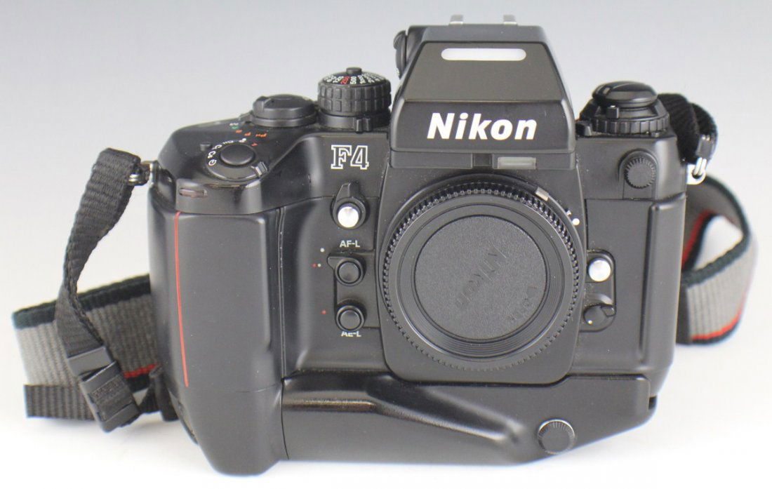 NIKON F4 SERIES CAMERA: NIKON F4 SERIES CAMERA Nikon F4 series camera with MB-21 battery pack and MF-23 Multi control back; Comes with Nikon strap.