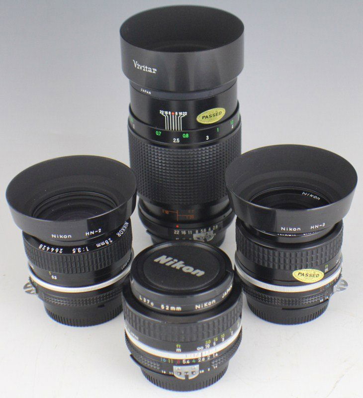 LOT OF SIX NIKON LENSES: LOT OF SIX NIKON LENSES Lot of five classic F-mount Nikon lenses and one Vivitar 90mm f/2.8 lens; Nikon models include Nikkor 35mm f/2.8 with HN-3 lens hood; 50mm f/1.4; 28mm f/3.5 with HN-2 lens hood