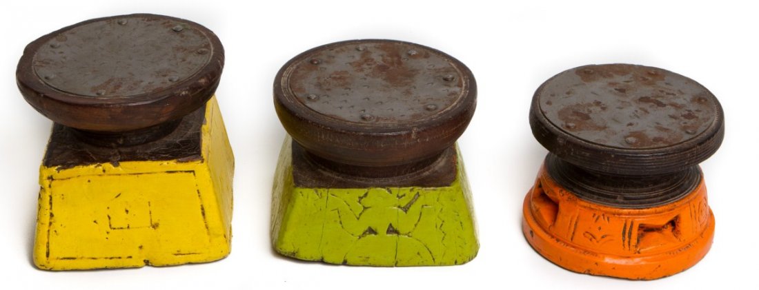 LOT OF THREE PAINTED HARDWOOD CARIBBEAN DRUMS: LOT OF THREE PAINTED HARDWOOD CARIBBEAN DRUMS Lot of three hand-carved hardwood Caribbean hand drums. Green, orange, and yellow. Size: about 7" wide with the tallest being 5"