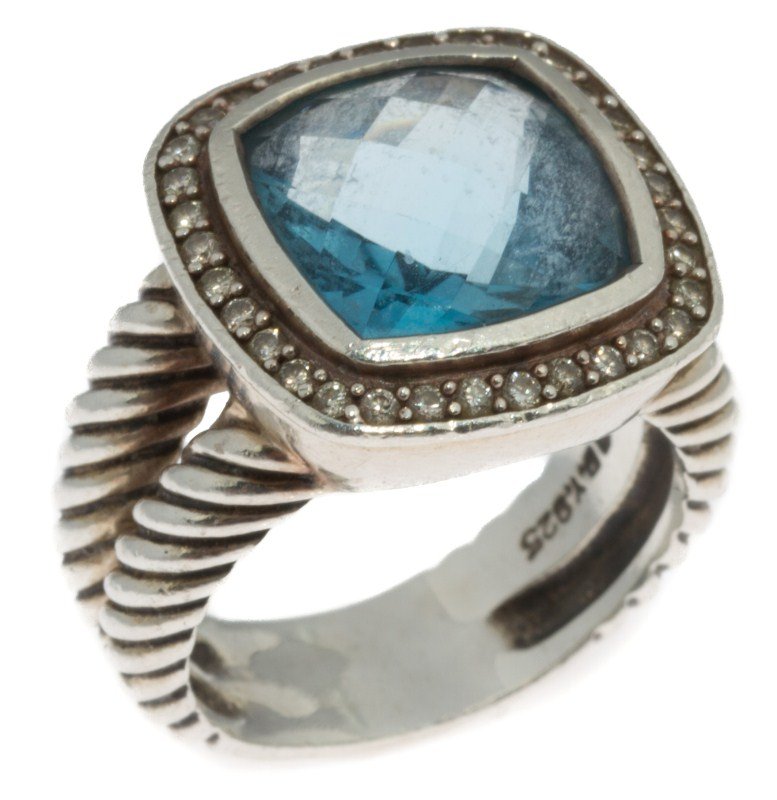 DAVID YURMAN STERLING DIAMOND & TOPAZ ALBION RING: DAVID YURMAN STERLING DIAMOND & TOPAZ ALBION RING David Yurman Albion sterling silver ring. 11mm checkerboard cut blue topaz stone. Surrounded by small round cut diamonds. Weight: 8.6g Size: 5