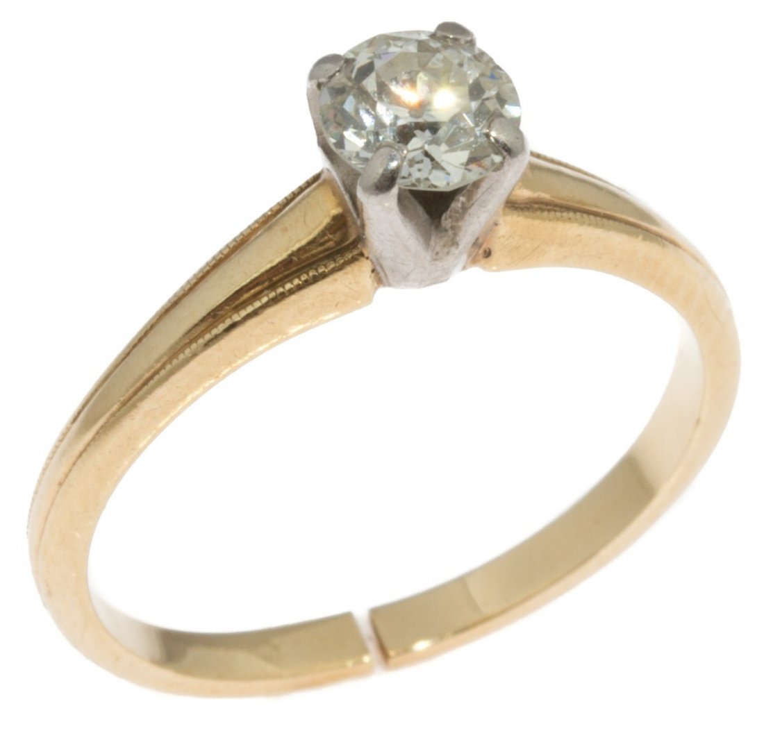 LADIES 14K GOLD DIAMOND SOLITAIRE ENGAGEMENT RING: LADIES 14K GOLD DIAMOND SOLITAIRE ENGAGEMENT RING Ladies solitaire engagement ring. Approximately a 0.5 ct round cut diamond of SI clarity and H-J color. 14K yellow gold band with white gold prongs. W