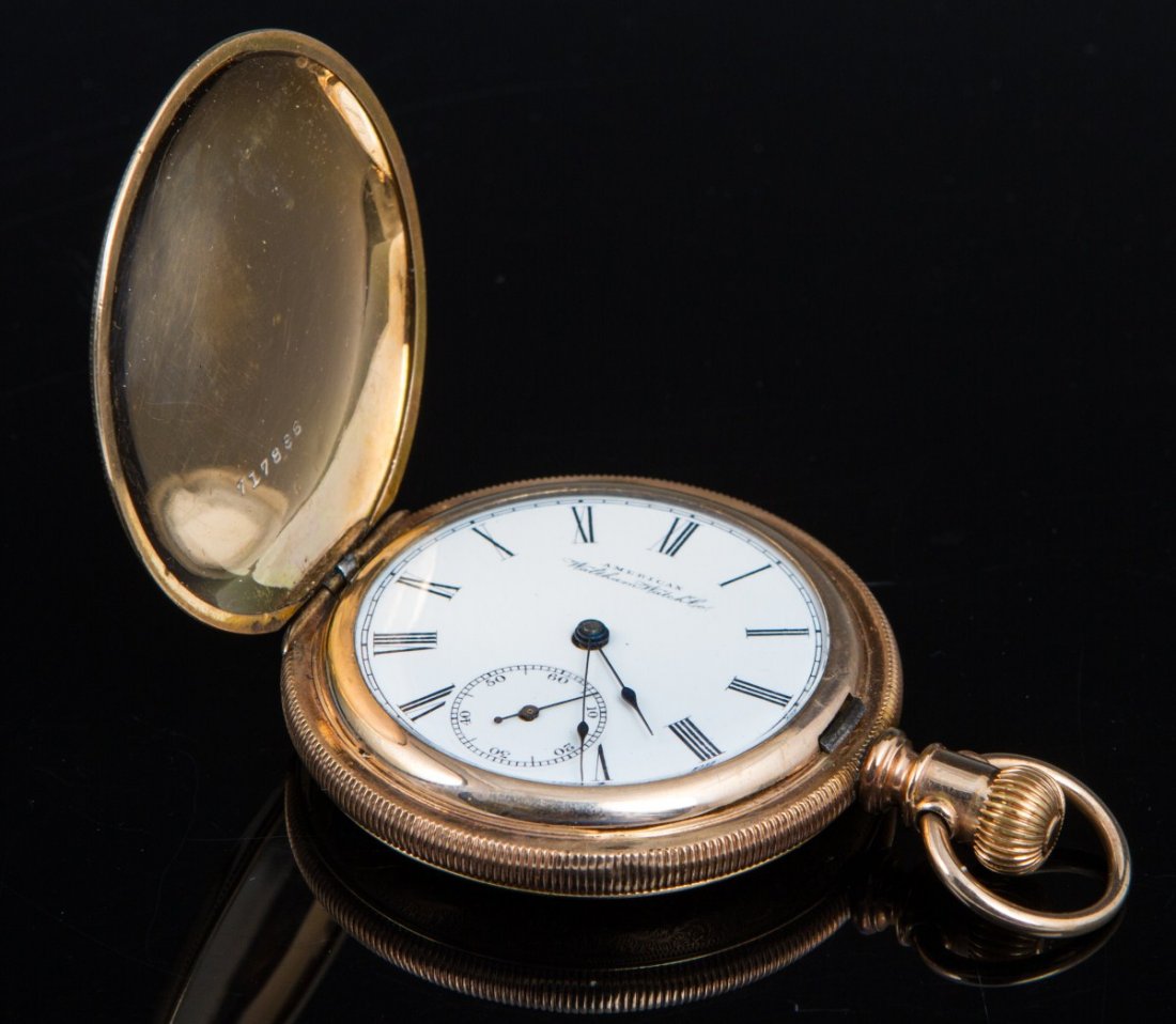 MENS WALTHAM POCKET WATCH 14K GF HUNTER CASE: MENS WALTHAM POCKET WATCH 14K GF HUNTER CASE A men's Waltham pocket watch with a 14K yellow gold filled hunter case. White dial with Roman numerals, second hand dial, sapphire hour and minute hands. C
