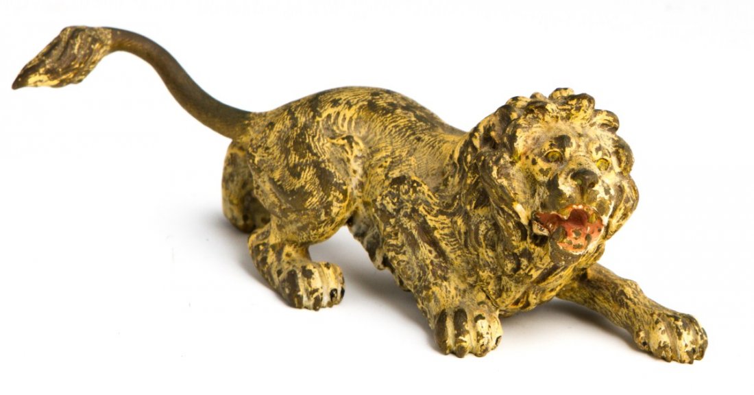VENETIAN COLD PAINTED BRONZE LION STATUE: VENETIAN COLD PAINTED BRONZE LION STATUE Cold painted Vienna bronze lion, circa 1900. Paint wear appropriate with age. Size: 6" long