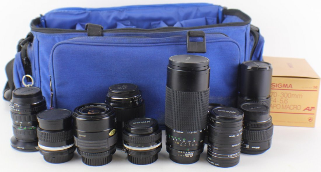 LARGE BLUE CAMERA BAG WITH 10 LENSES 15 FILTERS: LARGE BLUE CAMERA BAG WITH 10 LENSES 15 FILTERS Large blue camera case with 2 straps one black one blue. Lenses include, Sigma Zoom f=28 -70mm, Vivitar Super Cosina, Sigma APO Macro 70-300mm, Sakar AF