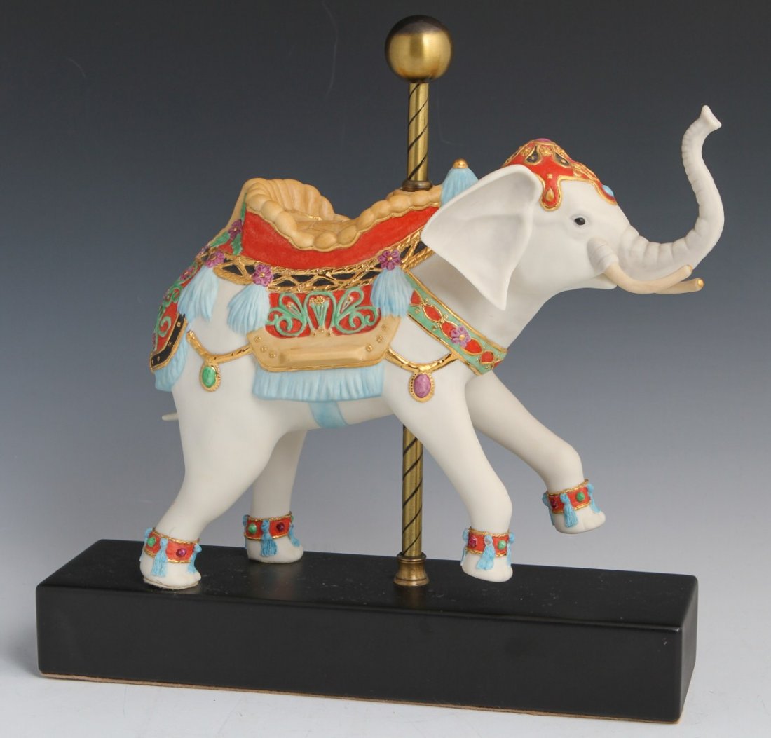 CYBIS PORCELAIN CAROUSEL ELEPHANT: CYBIS PORCELAIN CAROUSEL ELEPHANT Porcelain carousel elephant figurine by Cybis with very ornate saddle with floral and leaf motif. Size: 12" by 12.5"