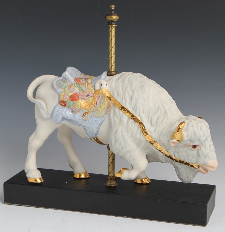 CYBIS PORCELAIN CAROUSEL BUFFALO #450: CYBIS PORCELAIN CAROUSEL BUFFALO #450 Porcelain carousel buffalo figurine by Cybis. Gold hoof details and swan and feather design on the saddle. Size: 12" by 12"