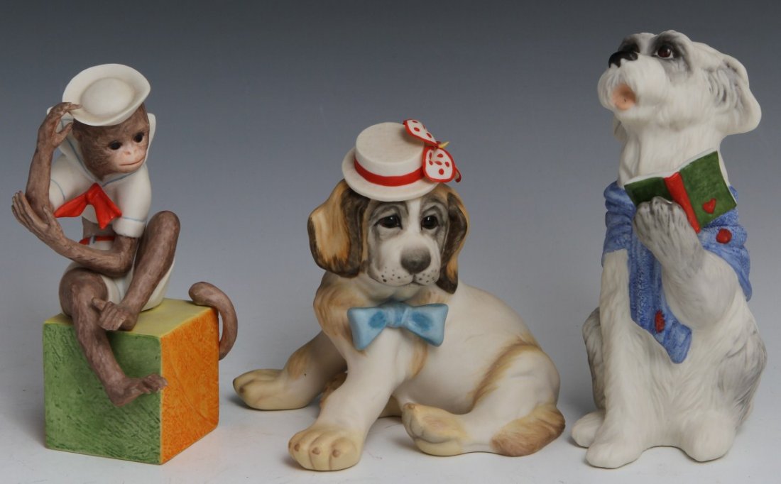 LOT OF 3 CYBIS PORCELAIN ANIMAL FIGURINES: LOT OF 3 CYBIS PORCELAIN ANIMAL FIGURINES Three porcelain animal figurines by Cybis, inlcuding: a singing dog (6.5"), a dog with a flower hat (4.5"), and a monkey in a sailor uniform (5.75").