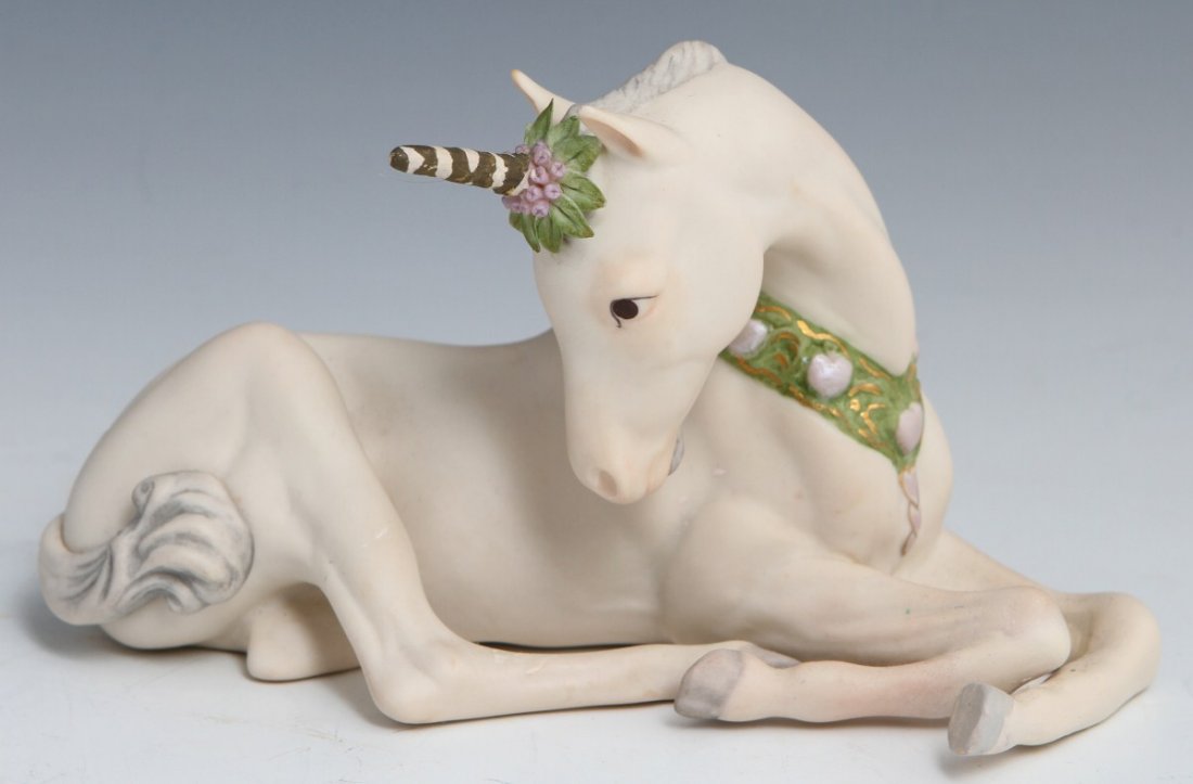 CYBIS SIR BAILEY UNICORN PORCELAIN FIGURE: CYBIS SIR BAILEY UNICORN PORCELAIN FIGURE Porcelain figure of a resting unicorn colt by Cybis dated 1982 on bottom. Sir Bailey, #6020. Signed on base. Size: 4"