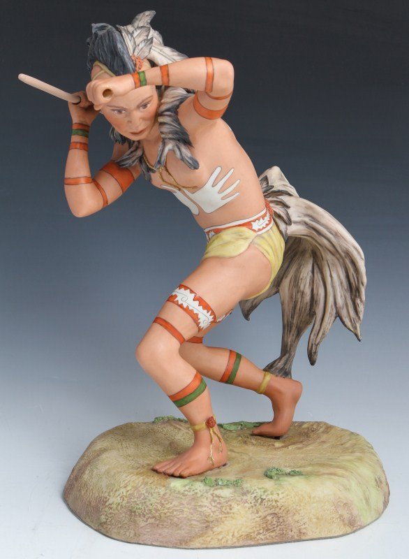 CYBIS NATIVE AMERICAN LACROSSE PORCELAIN FIGURE: CYBIS NATIVE AMERICAN LACROSSE PORCELAIN FIGURE Porcelain figurine by Cybis. Native American, #19. Signed and numbered. Native American male figure with lacrosse stick. Overall good condition with rep