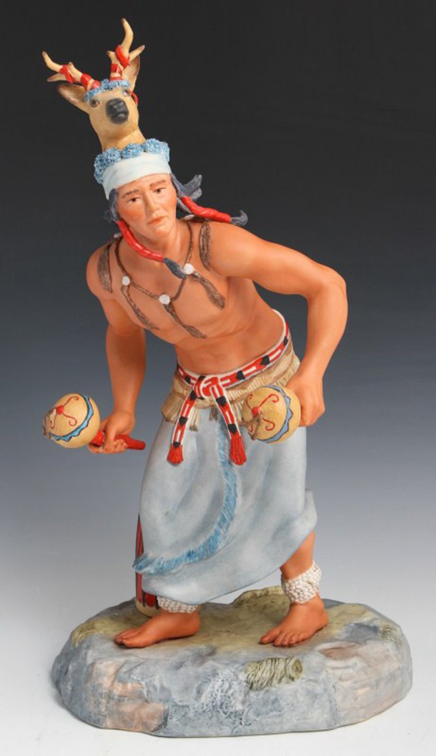 CYBIS NATIVE AMERICAN #20 PORCELAIN FIGURE: CYBIS NATIVE AMERICAN #20 PORCELAIN FIGURE Porcelain figurine by Cybis. Native American, #20. Signed and numbered. Native American male wearing large dear headdress. Overall good condition with chip t