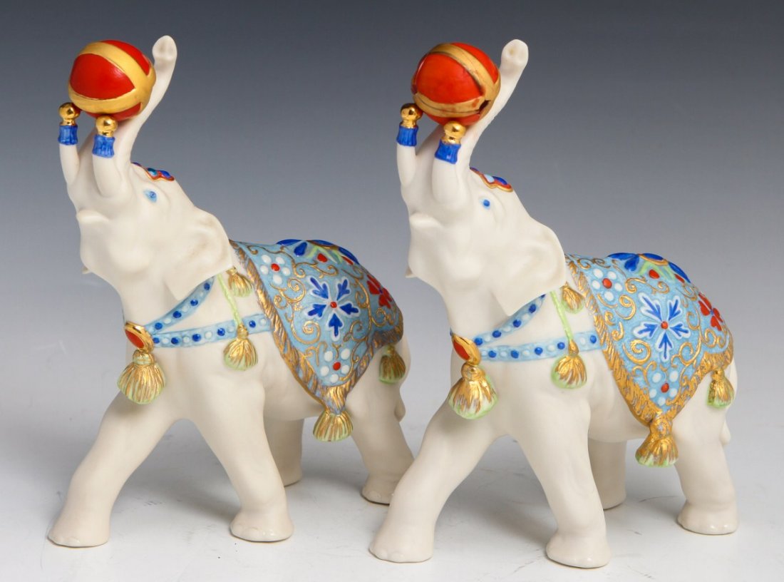 TWO ALEXANDER CYBIS CIRCUS ELEPHANTS: TWO ALEXANDER CYBIS CIRCUS ELEPHANTS CYBIS BISQUE FIGURE CIRCUS ELEPHANT A lot of two "ALEXANDER" circus elephants by Cybis. Elephant holding ball in trunk, hand painted , issued 1975. Overall good co