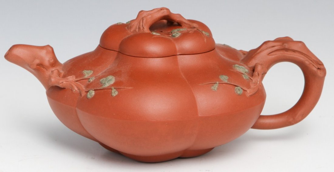 LARGE ZISHA YIXING TEAPOT W/CHERRY BLOSSOM MOTIF: LARGE ZISHA YIXING TEAPOT W/CHERRY BLOSSOM MOTIF 20th century Chinese redware teapot. Large gourd like teapot features cherry blossom accents. Markers mark is stamped on the inside of the lid. Size: 9