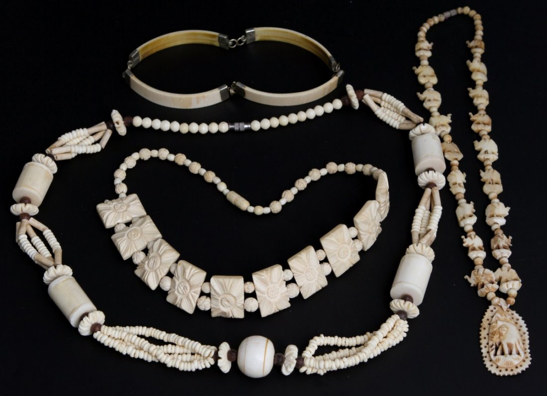 LOT OF 4 BONE AND IVORY NECKLACES: LOT OF 4 BONE AND IVORY NECKLACES Mixed lot of 4 includes a choker, a single strand with carved elephants, a single strand with carved floral beads, and a longer piece with various sizes of round bead