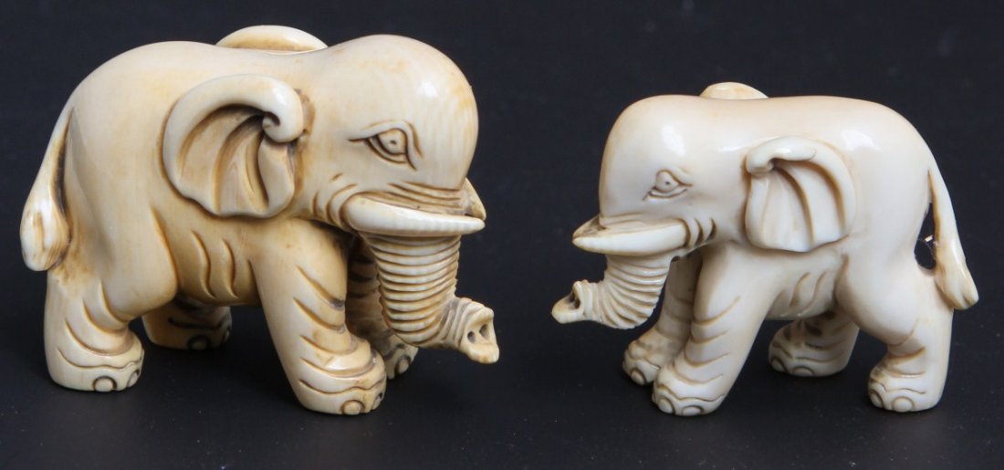 LOT OF TWO IVORY ELEPHANT NETSUKES: LOT OF TWO IVORY ELEPHANT NETSUKES Pair of Japanese carved ivory elephant netsuke, 1 1/2"h and 1 1/4"h Weight: 31g, 16g respective to height