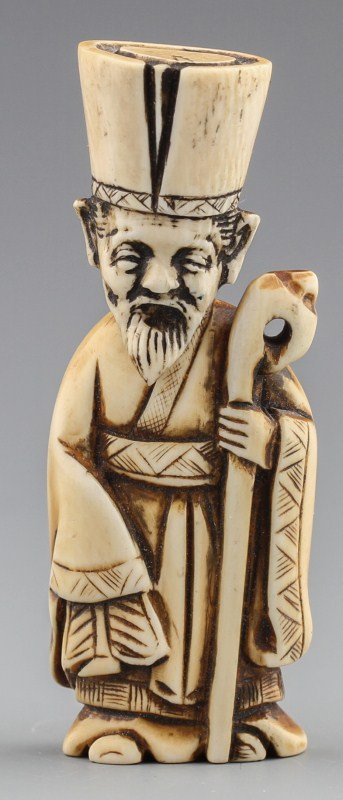 JAPANESE CARVED IVORY NETSUKE JUROJIN: JAPANESE CARVED IVORY NETSUKE JUROJIN Japanese carved ivory netsuke figure, Jurojin of the Shichi Fukujin, or seven lucky gods, stained. Pictured with staff. Signed. Overall very good condition, head 