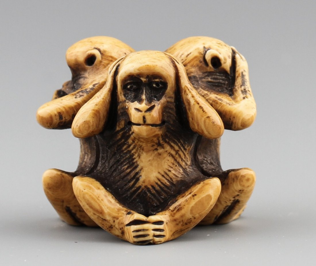 JAPANESE CARVED IVORY NETSUKE THREE MONKEYS: JAPANESE CARVED IVORY NETSUKE THREE MONKEYS Japanese carved ivory netsuke figure of three monkeys - see, hear, speak no evil. Stained. Signed. Size: 1 x 1.25 x 1.25" Weight: 22g